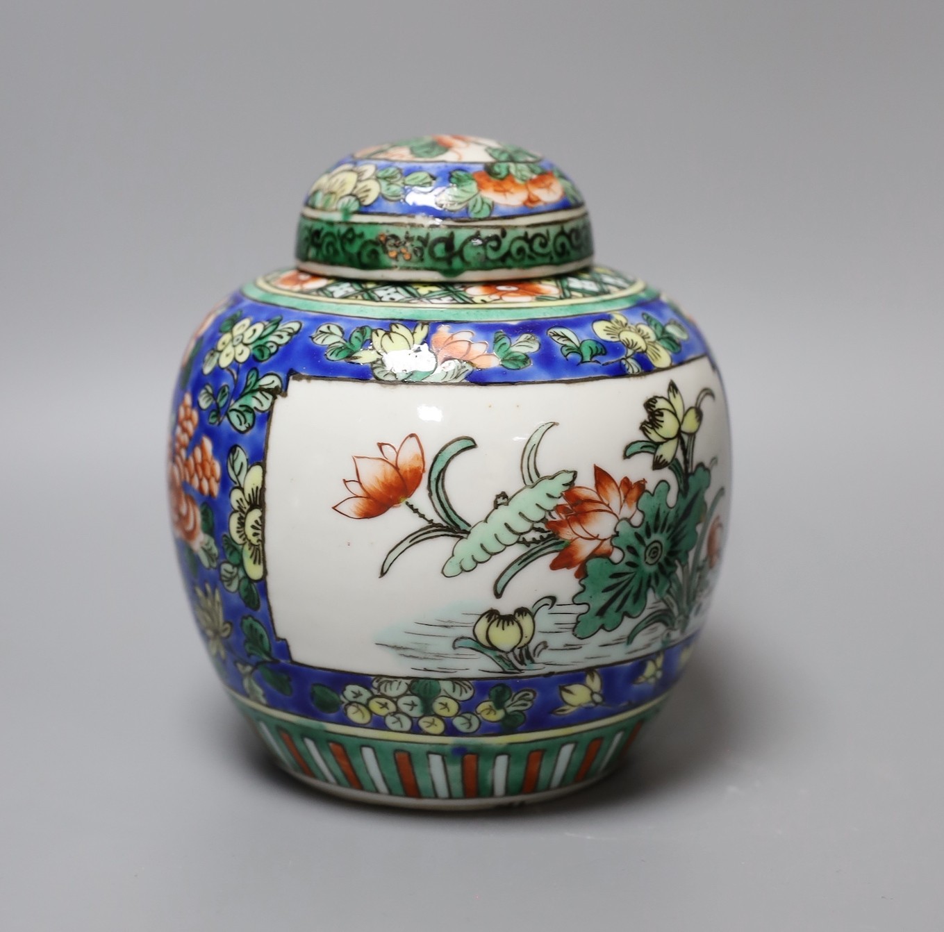 A Chinese ginger jar and cover, two tea bowls and a miniature teapot, tallest 16cm